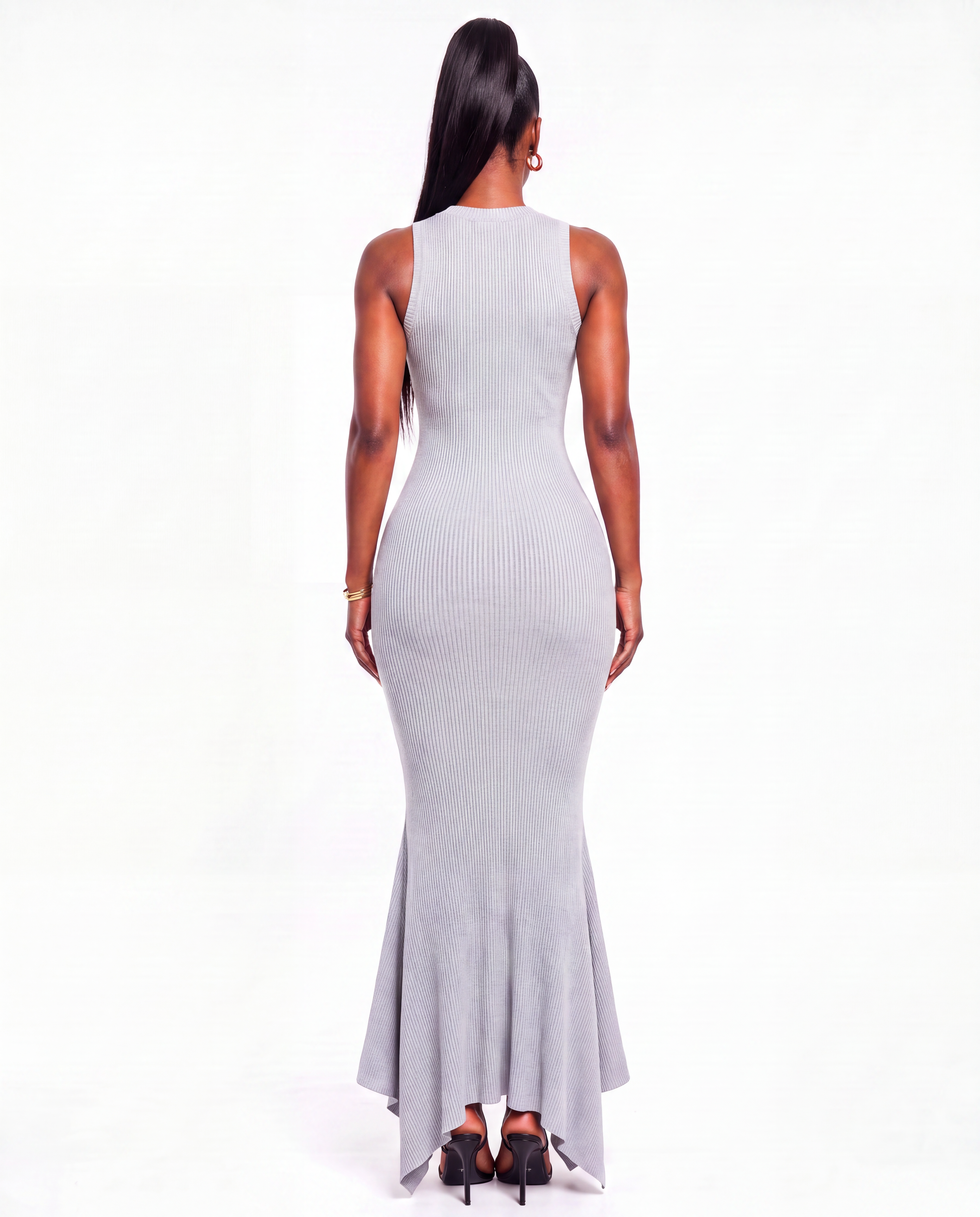 Generated_with_Kive.ai_-_Create_a_rear_full-body_studio_fashion_shot_of_Nikki_wearing_the_same_dress_from_the_current_image._Show_the_back_view_only__centered_on_a_pure_white_seamless-1